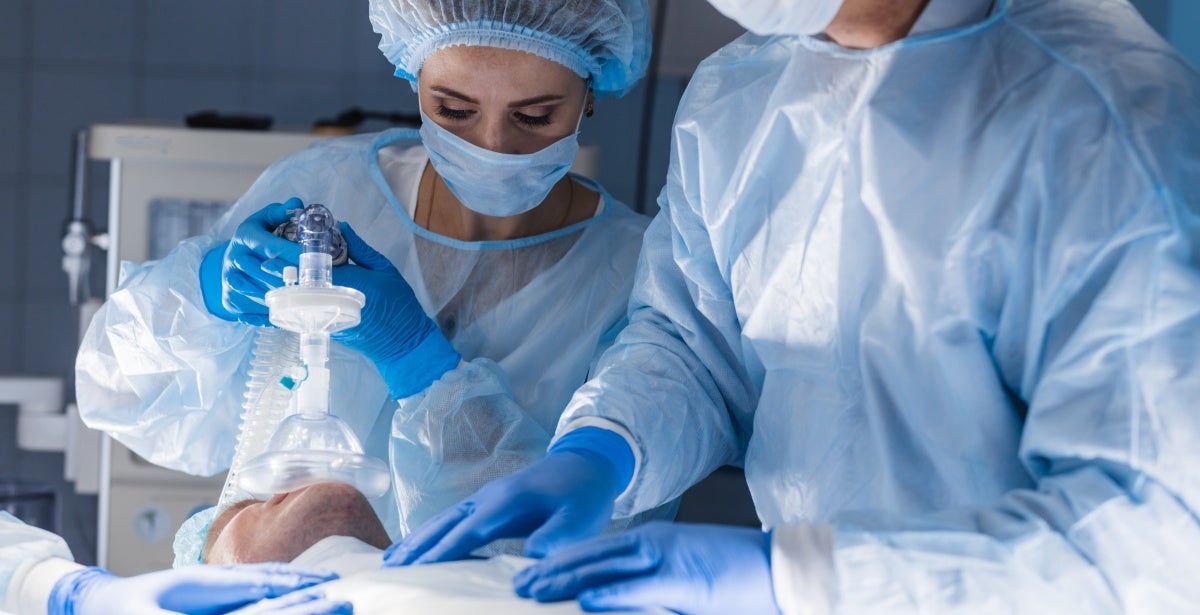 Nurse anesthetist giving anesthesia to patient